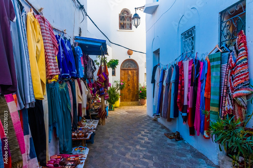 Street souvenyrs market in ancient white medina of the Asilah Village in Morocco