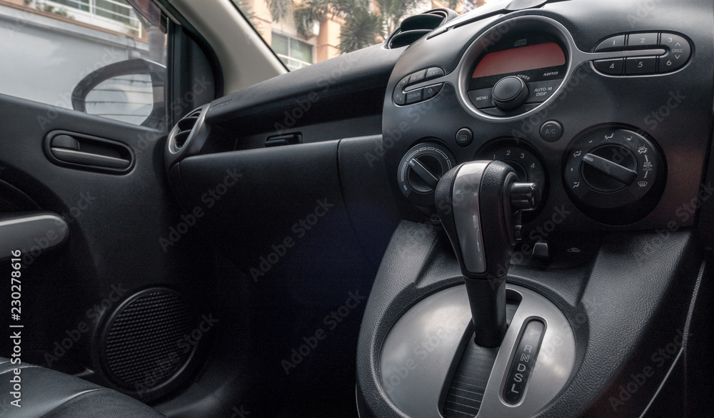 Car inside driver place. Front seats with dashboard control.