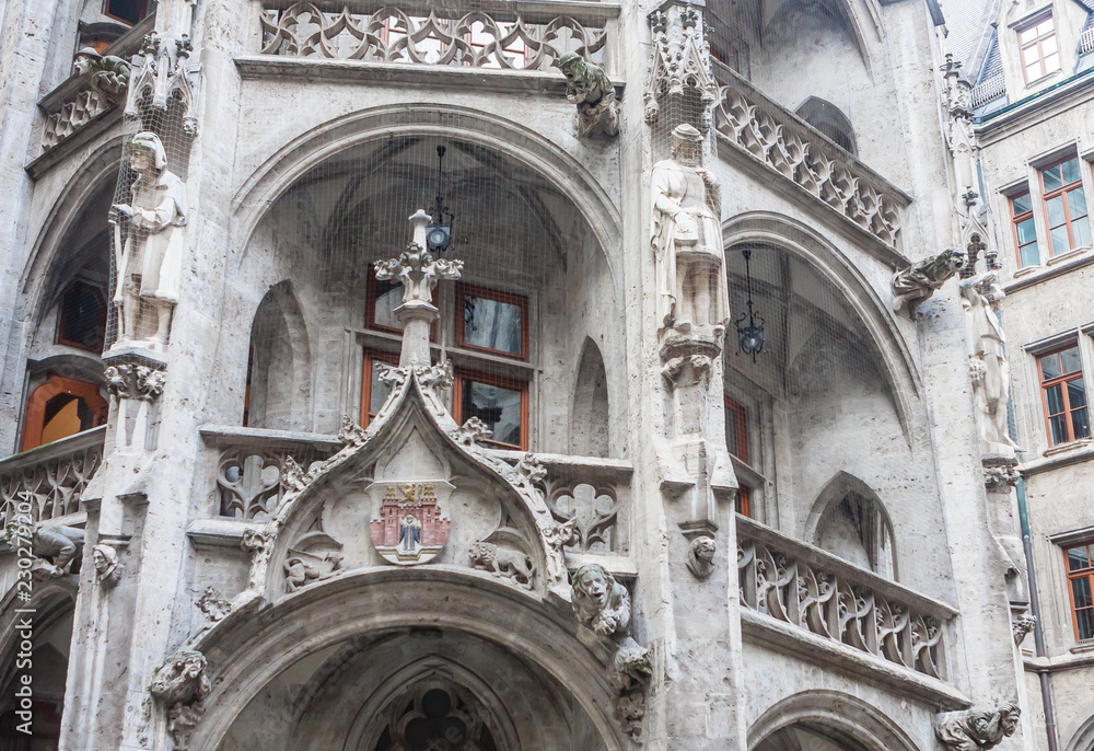 Fragment of New Town Hall of Munich (Neues Rathaus) neo-Gothic style palace in Marienplatz, the town square in historic center. Germany, Europe