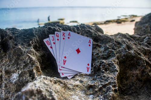 diamond royal flush poker card gamble beach theme