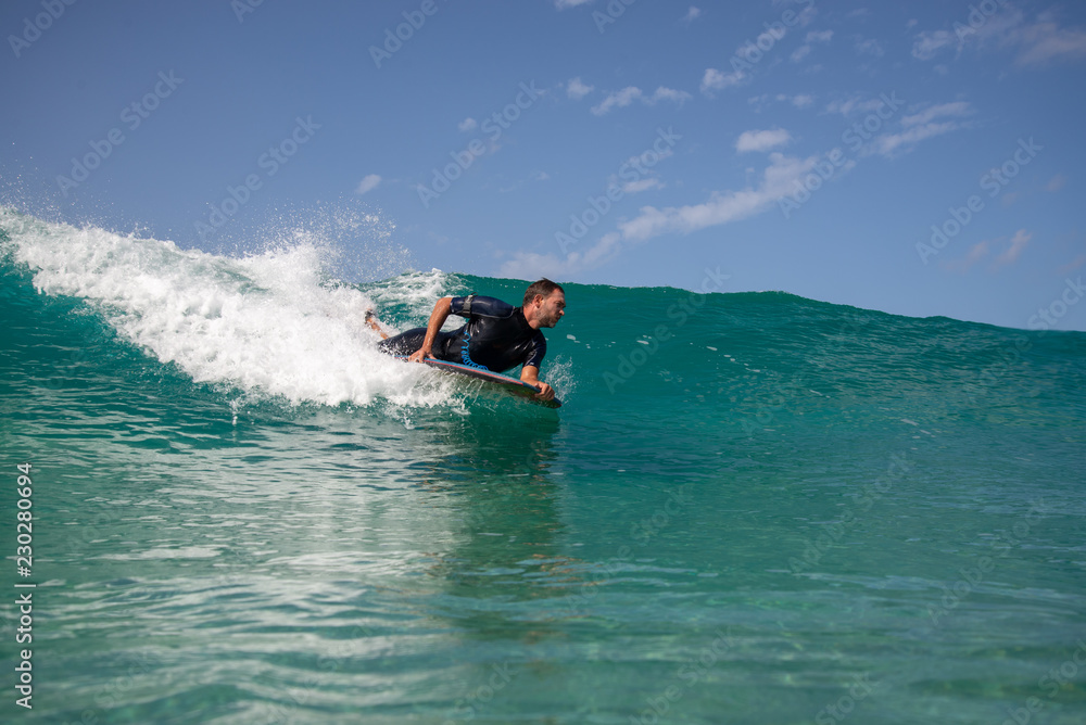 Naklejka premium surfer in action on the wave