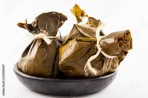 Photos Traditional Colombian tamale as made on Tolima region isolated on white backgrou