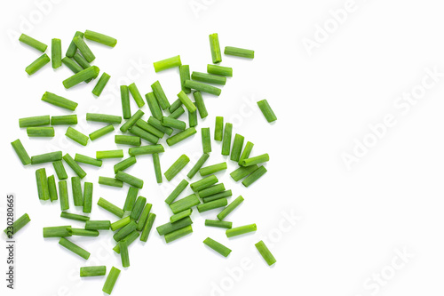 Heap of chopped spring onions isolated on white background with copy space
