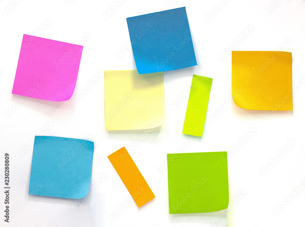 Collection of different colored sheets of note papers Isolated on white background Collection of different colored sheets of note papers Isolated on white background