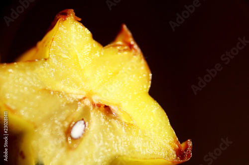 Carambola, star fruit isolated on dark background