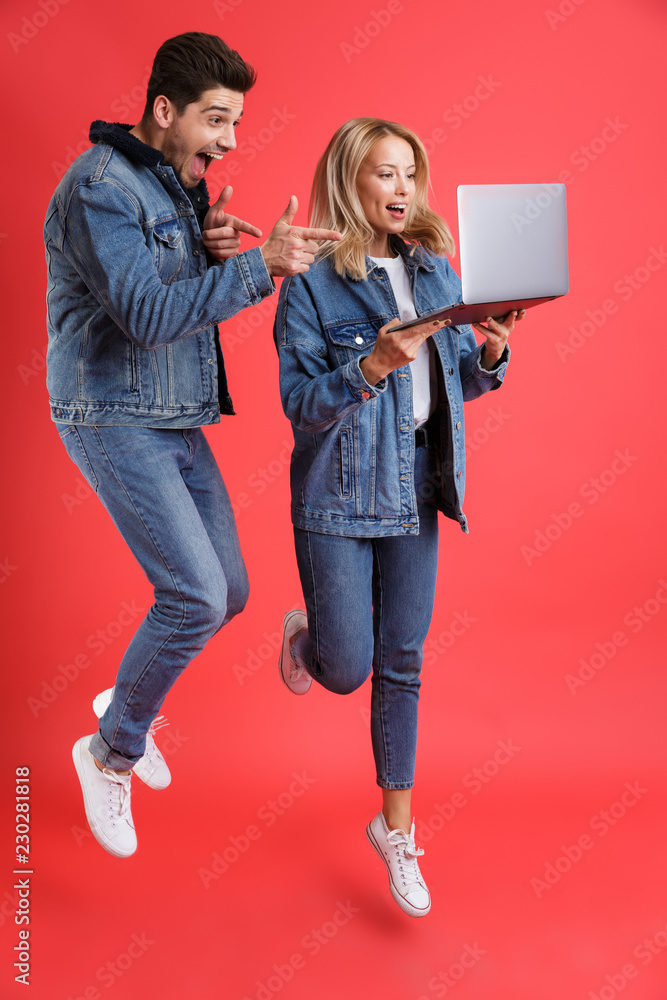 Full length portrait of an excited young couple