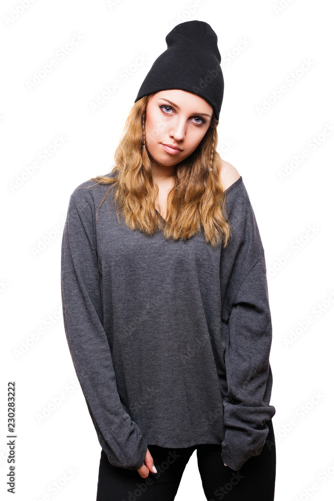 Cute teenage girl in casual gray and black outfit, posing. Studio lighting, isolated on white background. Cute teenage girl in casual gray and black outfit, posing. Studio lighting, isolated on white background.