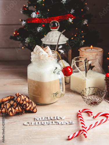 Mug with hot chocolate drink and marshmallows on the top. Christmas colorful still life. Cozy festive mood.