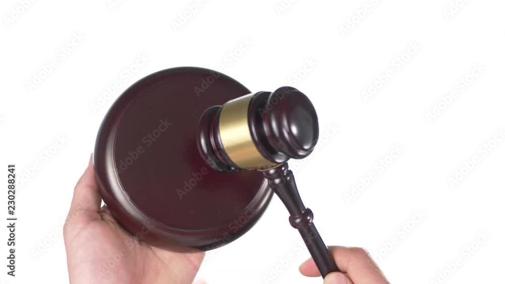 Concept of justice : hand holding a judge gavel and a sound block in hands Concept of justice : hand holding a judge gavel and a sound block in hands