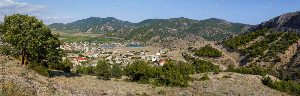 Panorama of the village Veseloe, Crimea on a sunny summer day