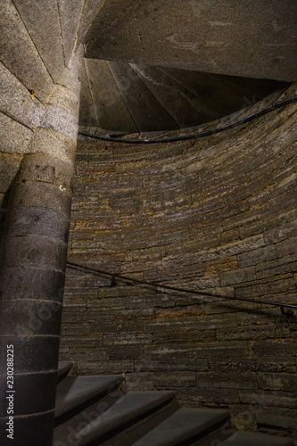 Dark stone spiral staircase inside the tower