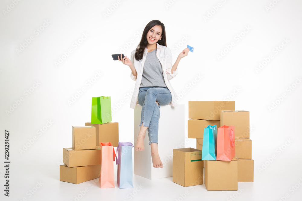 Young girl surrounded with her delivered online orders Young girl surrounded with her delivered online orders