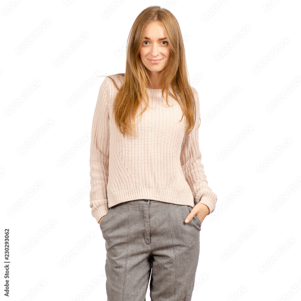 Beautiful woman in a sweater is smiling on a white background. Isolation Beautiful woman in a sweater is smiling on a white background. Isolation
