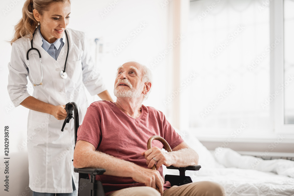 Greatly appreciate your concern. Portrait of smiling young lady in white lab coat taking care of patient Greatly appreciate your concern. Portrait of smiling young lady in white lab coat taking care of patient