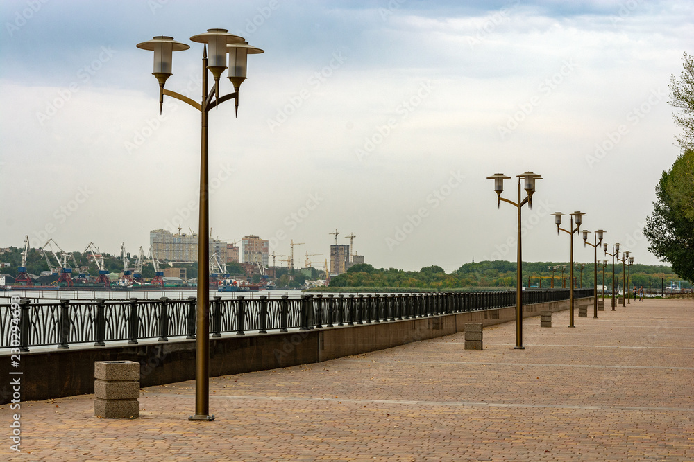 city embankment on the beach at sunset