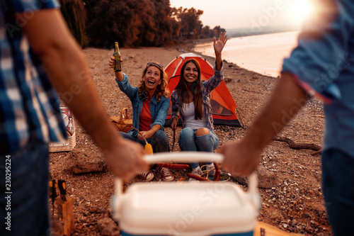 Photography Friends having party on the beach