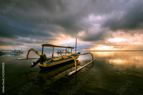 Traditional balinese fishing boat at sunrise, Sanur, Bali, Indonesia