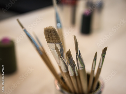 Creativity: Different paint brushes in a jar