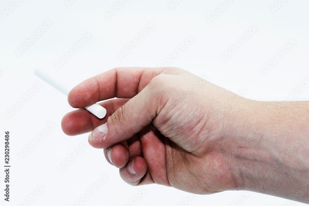 A close up of a a man holding a cigarette isolated on a white background A close up of a a man holding a cigarette isolated on a white background