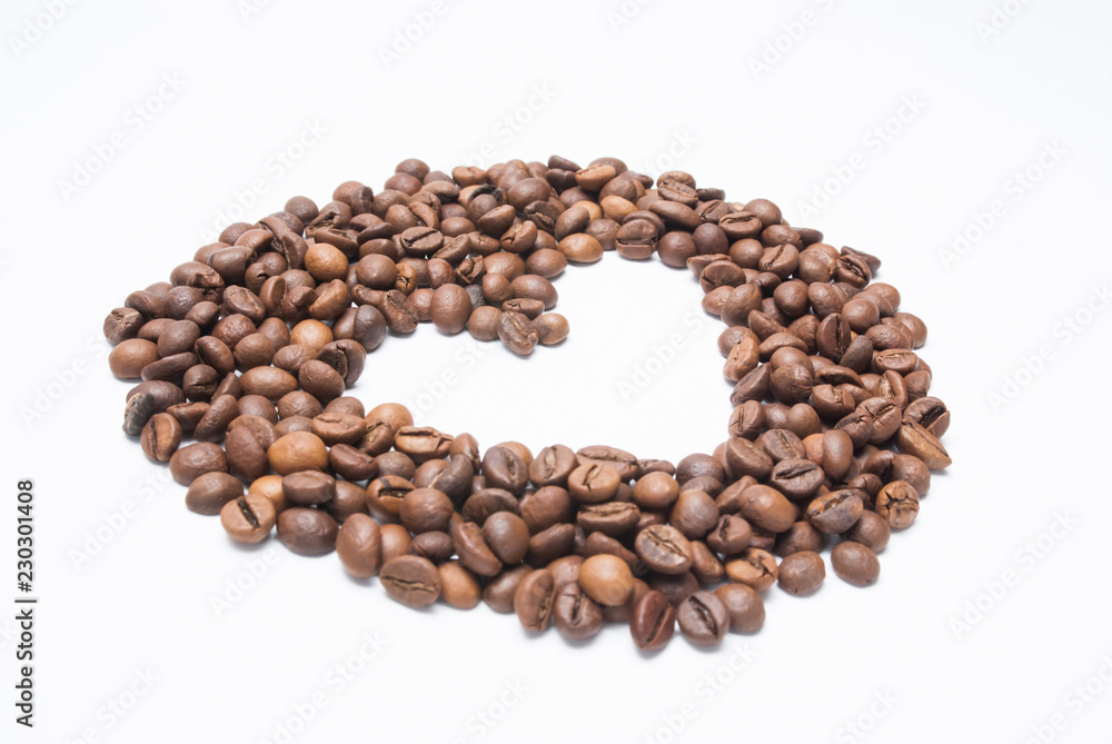 Coffee beans in the shape of a heart on a white background Coffee beans in the shape of a heart on a white background