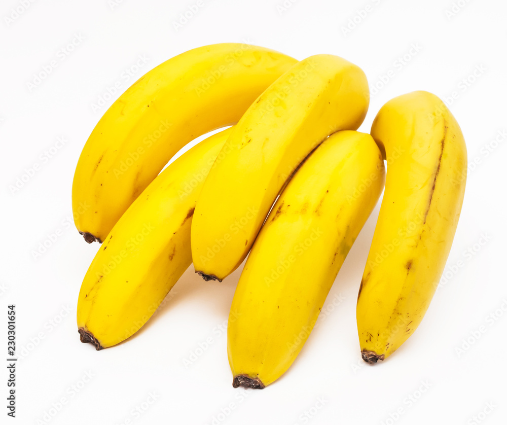 A branch of bananas close-up, isolated on white background