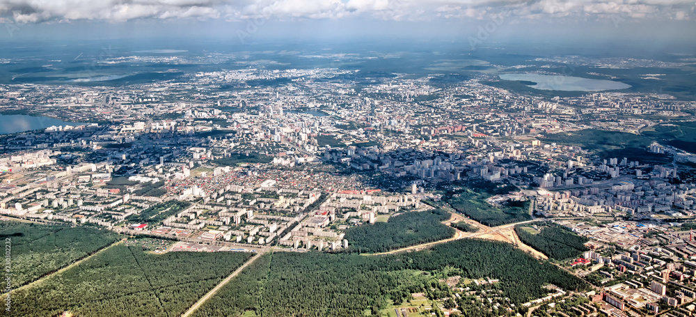 Aerial summer panoramic detailed landscape skyline overview of ural city Yekaterinburg in ural region russia with town road residential block forest park lake beautiful urban landmark air travel view