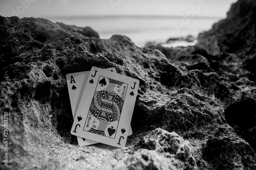 black jack poker card gamble beach theme black and white photo