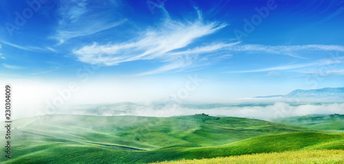 Idyllic view  foggy Tuscan hills at sunrise