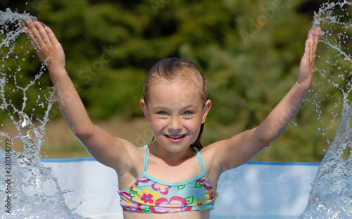 Girl playing in the water photo