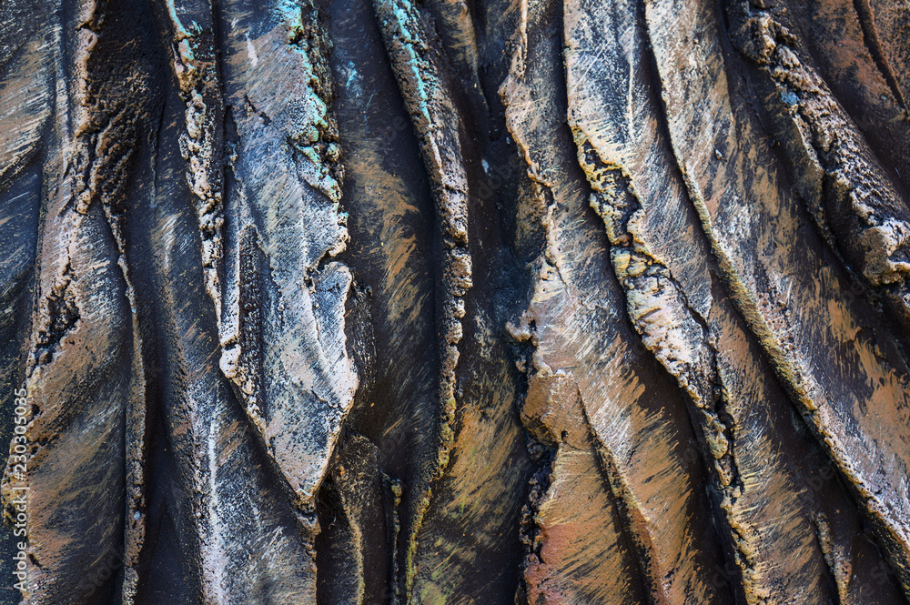 Close-up of a carved stone artifact. Exclusive texture. Concrete carving. Manual work
