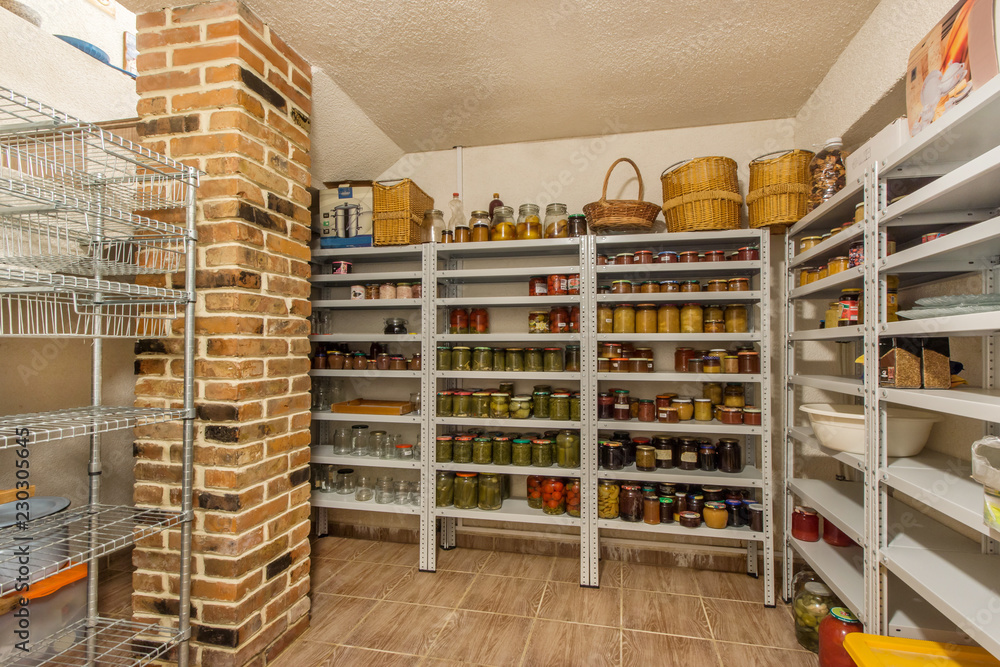 Home food storage room. Various jars with Home Canning Fruits and Vegetables jam on shelves Home food storage room. Various jars with Home Canning Fruits and Vegetables jam on shelves