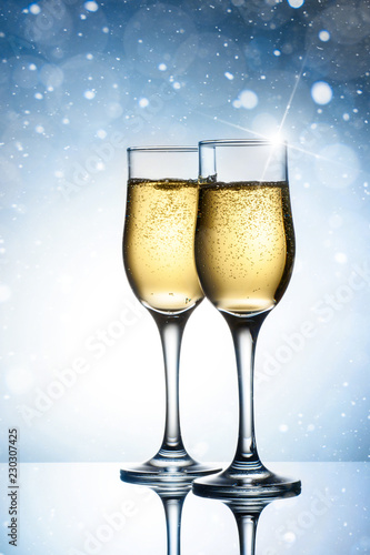 Two elegant glasses with sparkling champagne