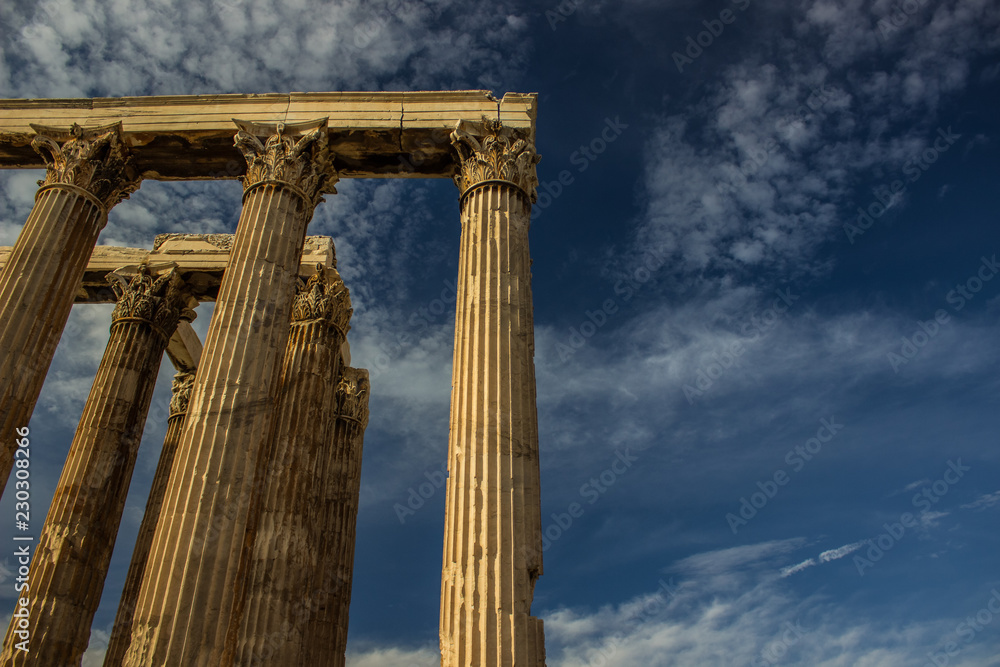 Greek open outdoor museum ancient antique ruins and marble columns on blue vivid sky background, copy space 