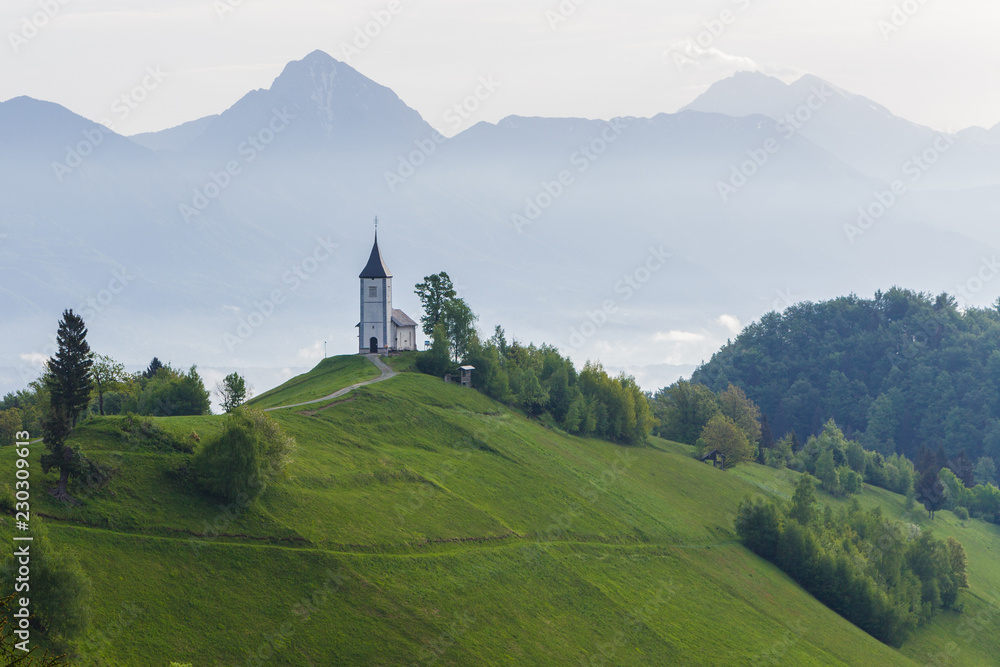 Spring mountain landscape in Slovenia, morning mist over the valley