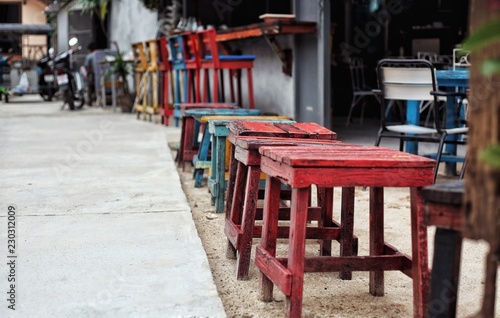 old multi-colored stools, red, blue, yellow..