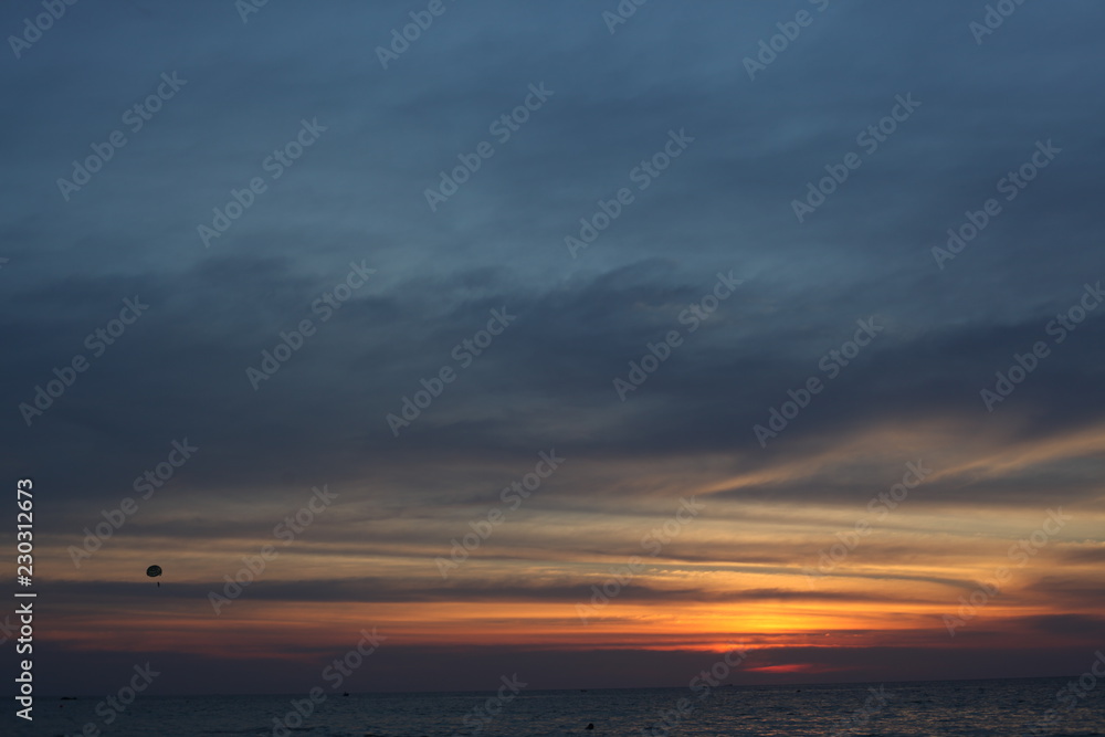 sunset on the sea, parachute, beautiful sky.