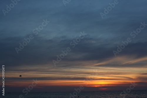sunset on the sea, parachute, beautiful sky. © ALEKSANDR