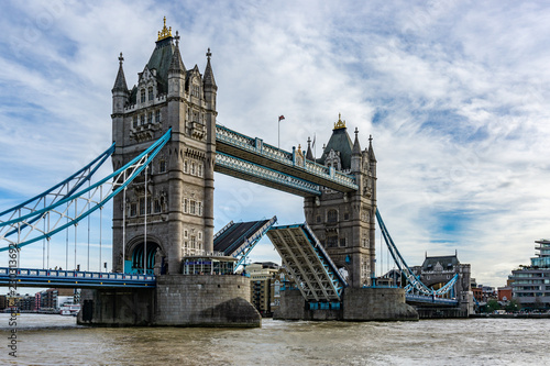 Obraz na płótnie Tower Bridge on Thames river with the bridge open for ship traffic in London, UK w salonie
