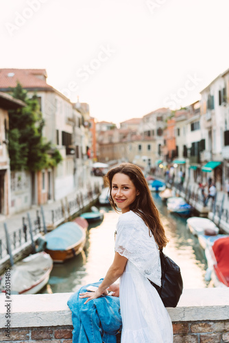 young girl walks the streets of Venice © teksomolika
