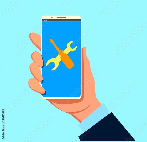 Phone repair, smartphone maintenance. Wrench and screwdriver on mobile phone screen. Technical support, settings, technical issues concepts.