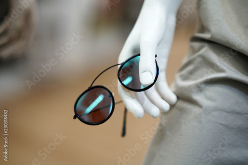 Sun glasses in mannequin hand