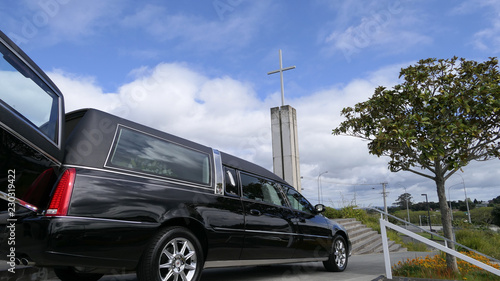 Shot of hearse arriving or leaving a funeral photo