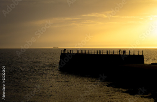 Silhouetted Pier at Sunset