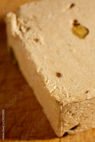 A block of American style Halavah with pistachios.