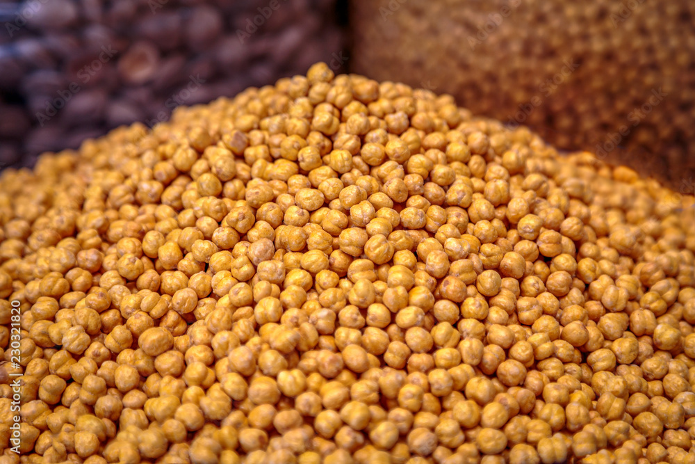 Heap of spicy salty hazelnuts exposed for sale on the farm market. Closeup, food photography. Heap of spicy salty hazelnuts exposed for sale on the farm market. Closeup, food photography.