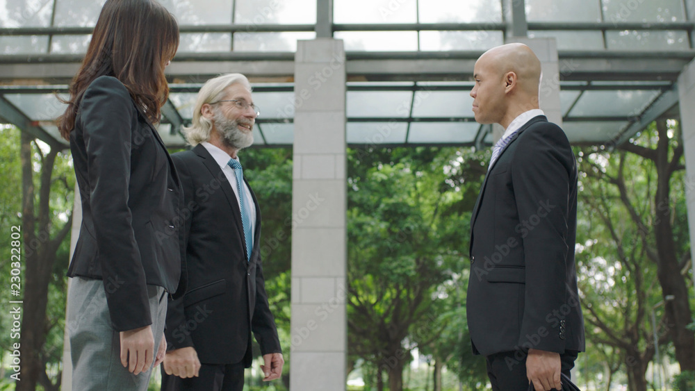 corporate business people talking in building lobby corporate business people talking in building lobby