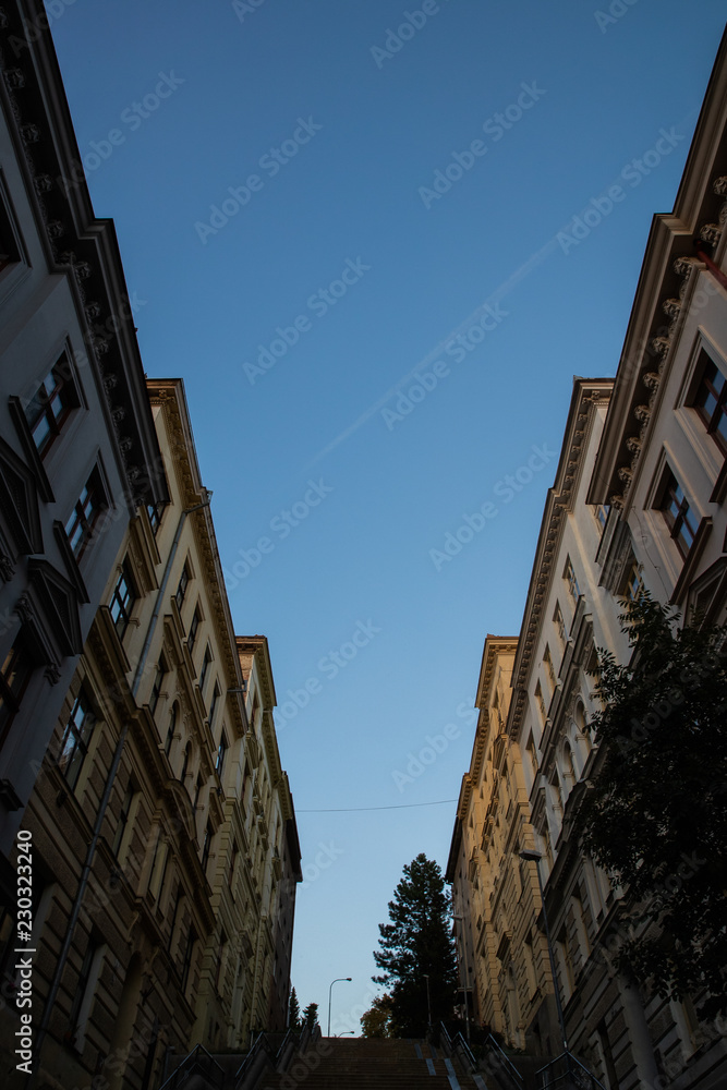 View of the sky Brno famous luxury street Schodov known for its beautiful high staircase leading to villas on a hill during a sunny day.