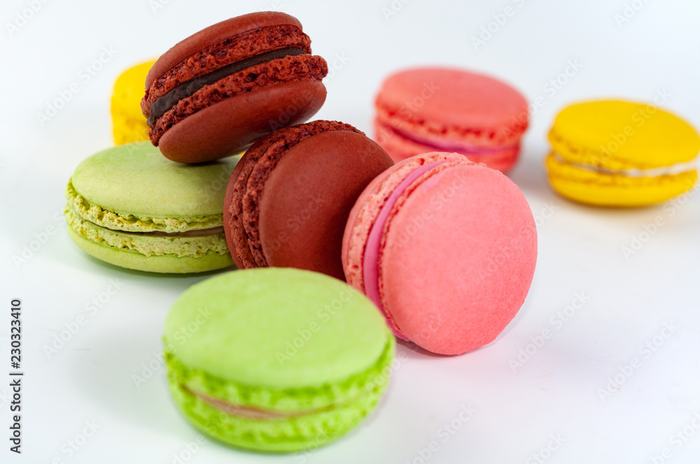 Macaron cakes of different colors isolated on a white background Macaron cakes of different colors isolated on a white background