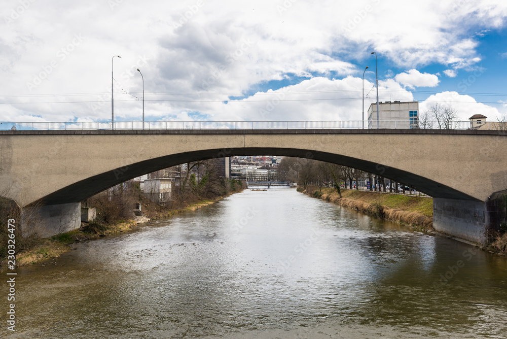 Bridge in concrete single arch on a small urban river