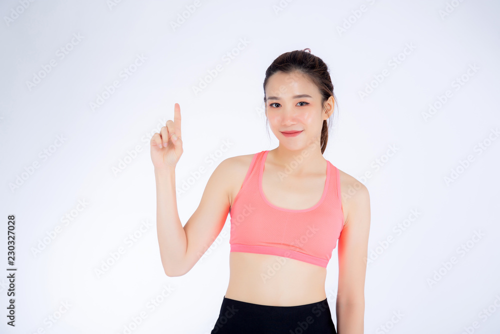 Beautiful portrait young asian woman in sport clothing with satisfied and confident isolated on white background, girl asia have wellness finger point something, exercise for fit with health concept.